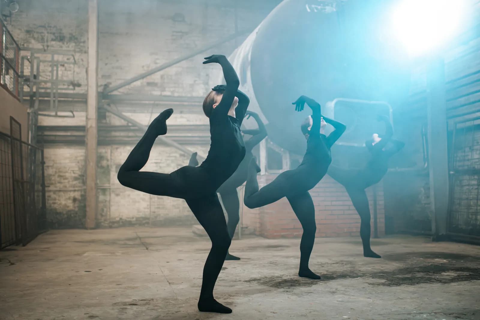 Still from the dance film Shadowash showing four dancers posing