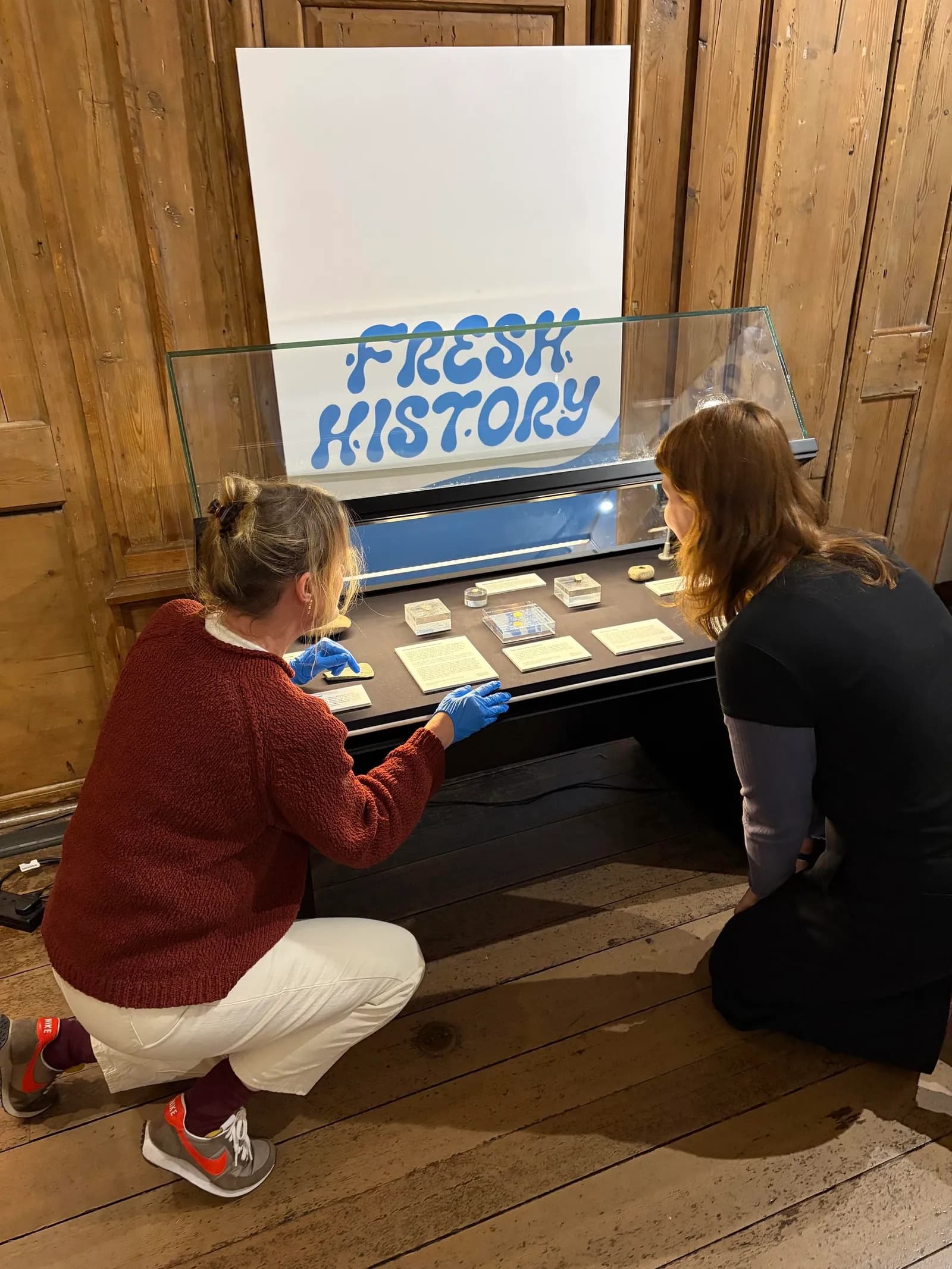 Museum of Edinburgh staff viewing archaeology material included in the Fresh History exhibition.